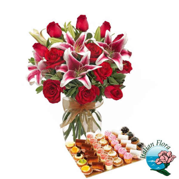 Bouquet of red roses and pink lilies with sweets